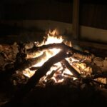 large fire in a cozy outdoor fire pit at a private psilocybin session, Algarve Portugal