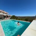 pool splash 50 year old brown woman retreat