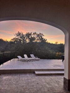 sunrise with loungers on large terrace