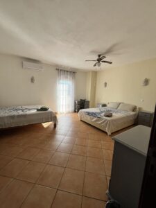 two double beds in a shared deluxe room at psilocybin retreat portugal