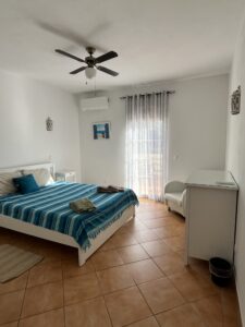 large bed with light coming in psilocybin retreat