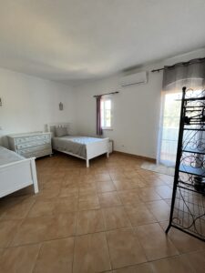 two single beds in a large shared room psilocybin mushroom retreat