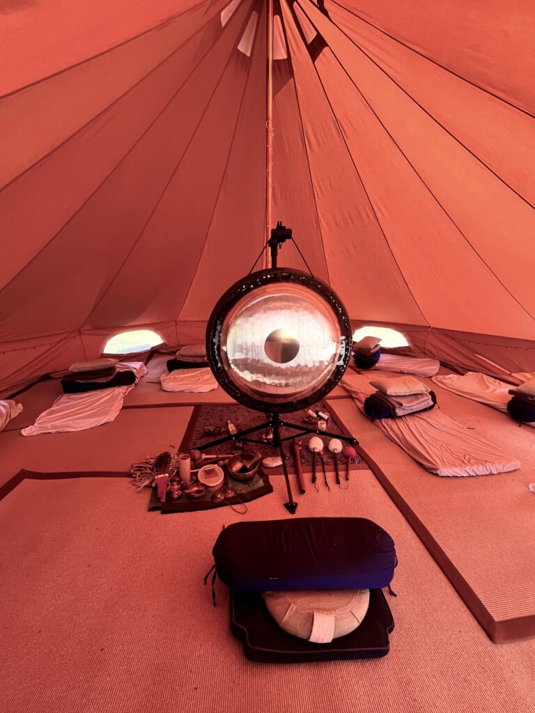 large gong set up for a sound bath in a 6m bell tent
