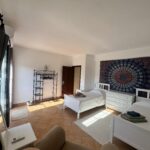a double occupancy room with AC and terrace access. two single beds.