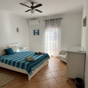 large bed with light coming in psilocybin retreat