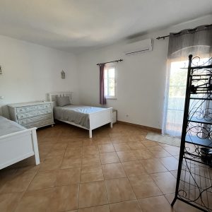 two single beds in a large shared room psilocybin mushroom retreat